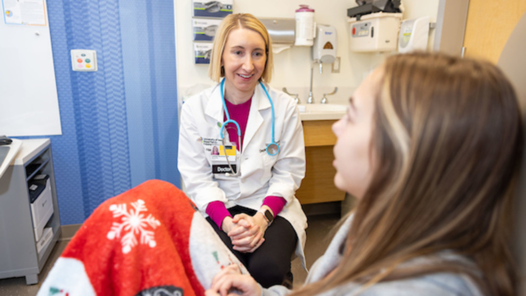 Dr. Harshman with pediatric transplant patient